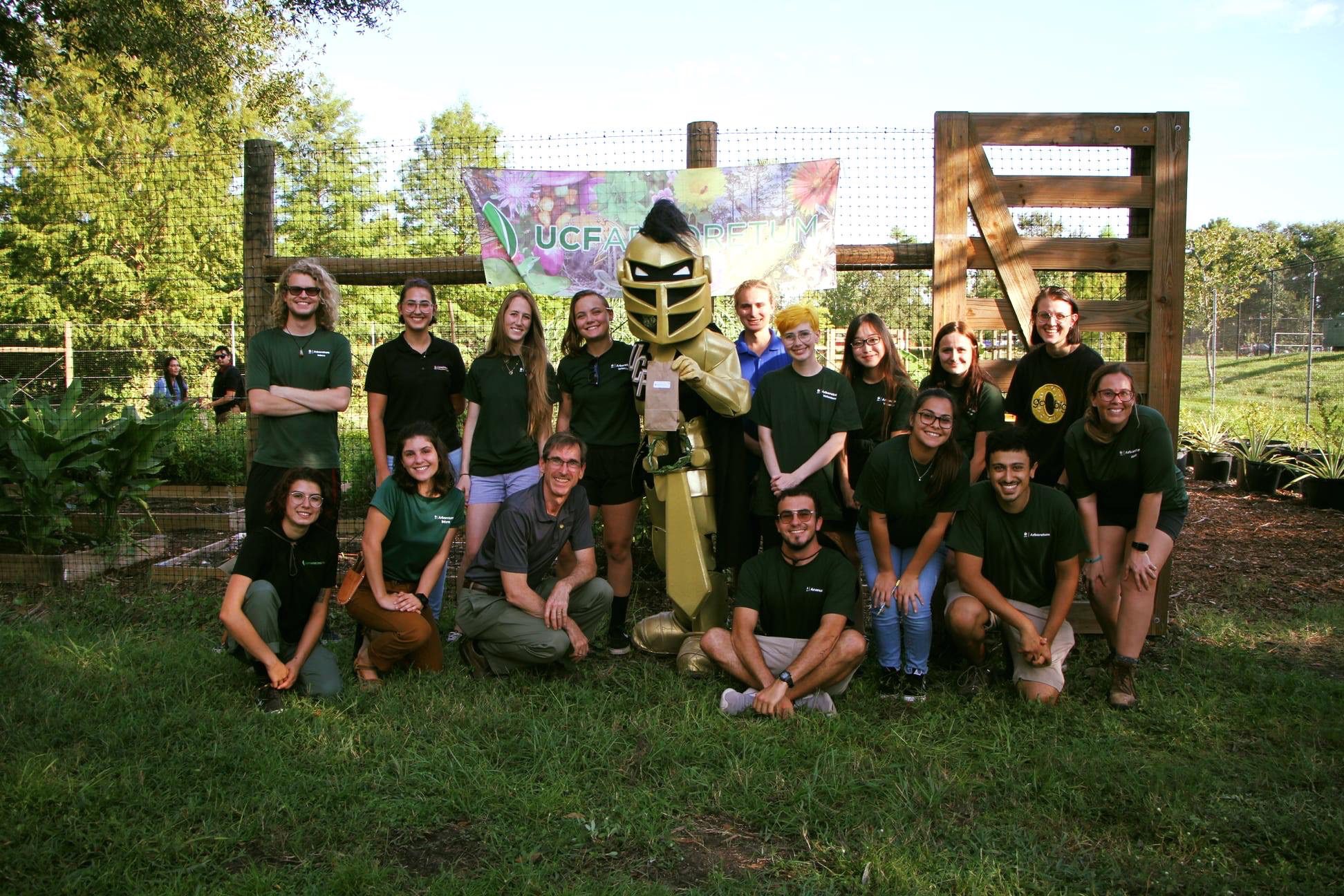 LxL interns working together in a garden bed at the UCF Arboretum